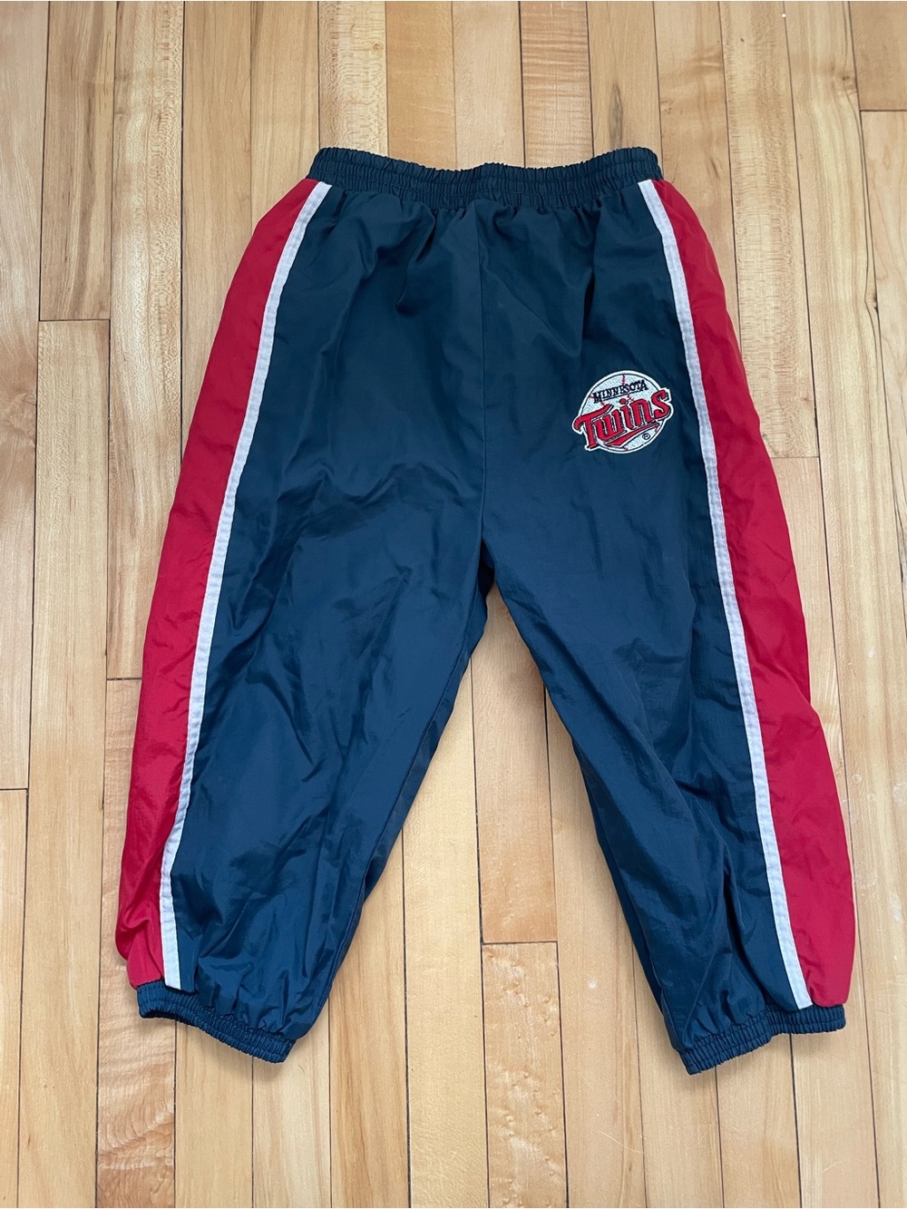 Vintage Minnesota Twins navy blue track pants with red side panels and white str